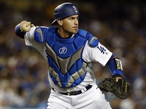 Los Angeles Dodgers catcher Yasmani Grandal throws out San Diego Padres' Wil Myers on an infield ground ball during the first inning of a baseball game in Los Angeles, Tuesday, Sept. 26, 2017. (AP Photo/Alex Gallardo)