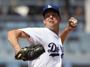 Los Angeles Dodgers pitcher Rich Hill throws to the plate during the second inning of a baseball game against the Colorado Rockies, Sunday, Sept. 10, 2017, in Los Angeles. (AP Photo/Michael Owen Baker)