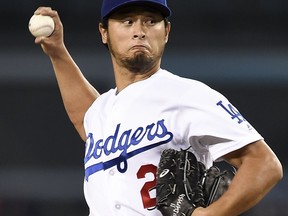 Los Angeles Dodgers starting pitcher Yu Darvish pitches to San Diego Padres' Carlos Asuaje during the first inning of a baseball game in Los Angeles, Monday, Sept. 25, 2017. (AP Photo/Kelvin Kuo)