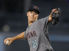 Arizona Diamondbacks starting pitcher Zack Greinke winds up during the first inning of a baseball game against the Los Angeles Dodgers, Tuesday, Sept. 5, 2017, in Los Angeles. (AP Photo/Mark J. Terrill)