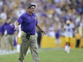 LSU head coach Ed Orgeron smiles after his team scored their first touchdown against Chattanooga during the first half of an NCAA college football game in Baton Rouge, La., Saturday, Sept. 9, 2017. (AP Photo/Rusty Costanza)