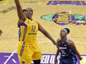 Los Angeles Sparks guard Chelsea Gray, left, shoots as Atlanta Dream guard Tiffany Hayes defends during the first half of a WNBA basketball game, Friday, Sept. 1, 2017, in Los Angeles. (AP Photo/Mark J. Terrill)