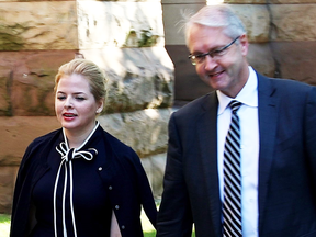 Laura Miller, ex-deputy chief of staff to former Ontario premier Dalton McGuinty, arrives at court with her lawyer Scott Hutchison in Toronto on Sept. 22, 2017.