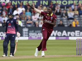 West Indies' Jason Holder celebrates after taking the wicket of England's Eoin Morgan during the third One Day International against West Indies at Bristol County Ground, England, Sunday Sept. 24, 2017. (David Davies/PA via AP)