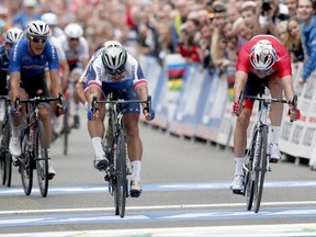 Peter Sagan of Slovakia, center, finishes in first place with Alexander Kristoff of Norway in second place in the Men's Elite Road Race at the UCI 2017 Road World Championship, in Bergen, Norway Sunday Sept. 24, 2017. (Cornelius Poppe/NTB Scanpix via AP)