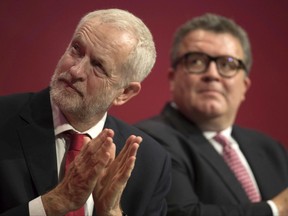Labour Party leader Jeremy Corbyn, left, and deputy leader Tom Watson attend the opening session of the Labour Party annual conference at the Brighton Centre, Brighton, England, Sunday Sept. 24, 2017. (Stefan Rousseau/PA via AP)