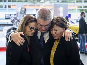 President of the International Olympic Committee Thomas Bach comforts Ilana Romano, widow of Israeli weightlifter Josef Romano, left, and Anke Spitzer, widow of Israeli fencing coach Andre Spitzer, right, during a commemoration ceremony on the occasion of the 45th anniversary of the death of 11 Israeli athletes killed by a Palestinian militant group during the 1972 Munich Olympics. (Matthias Balk/dpa via AP)