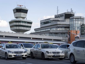 FILE - In this Sept. 18, 2017 file photo taxis stand in front Berlin Tegel airport in Berlin, Germany. During the German parliament election, Sunday, Sept. 24, 2017 Berlin residents are also called to decide on the future of Tegel airport. (Bernd von Jutrczenka/dpa via AP, file)