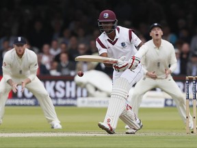West Indies' Kraigg Brathwaite plays a shot off the bowling of England's James Anderson on the first day of the third test match between England and the West Indies at Lord's cricket ground in London, Thursday, Sept. 7, 2017. (AP Photo/Kirsty Wigglesworth)