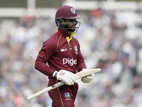West Indies' Shai Hope leaves the pitch after being caught by England's Jos Butler off the bowling of England's Chris Woakes during the One Day International cricket match between England and the West Indies at the Oval cricket ground in London, Wednesday, Sept. 27, 2017. (AP Photo/Kirsty Wigglesworth)