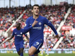 Chelsea's Alvaro Morata scores his side's forth goal of the game during the English Premier League soccer match between Stoke City and Chelsea at the bet365 Stadium, Stoke-on-Trent, England, Saturday, Sept. 23, 2017. (Nigel French/PA via AP)
