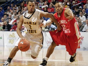 FILE -  In this Saturday, March 6, 2010 file photo, Wichita State's Clevin Hannah, left, drives around Illinois State's Lloyd Phillips, in the second half of a Missouri Valley Conference tournament semi-final basketball game. Americans who didn't make the NBA get second chance at basketball stardom in Africa. Africa generally exports basketball players to the United States, but a handful of American professionals have gone the other way. The African championship, known as AfroBasket, begins its knockout stage Thursday, Sept. 14, 2017 in Tunisia and features several Americans who were granted citizenship to play for African teams. (AP Photo/Tom Gannam, File)