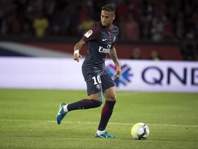 FILE - In this file photo dated Friday, Aug. 25, 2017, PSG's Neymar during the French League One soccer match between Paris Saint Germain and Saint Etienne at the Parc des Princes stadium in Paris, France. The French capital club PSG broke the world record fee to sign Neymar from Barcelona for 222 million euros ($262 million).  (AP Photo/Kamil Zihnioglu, FILE)