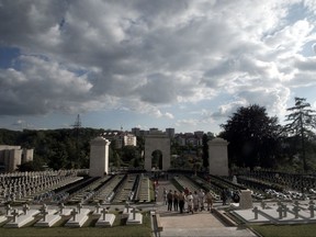 FILE - In this Thursday, June 23, 2005 file photo, the general view of a memorial to Polish soldiers, who struggled against Ukrainians, at the cemetery of Orlyats in Lviv, Western Ukraine.  The Polish government is abandoning a plan to include images in Polish passports of landmarks in formerly Polish cities that are today within the borders of Ukraine and Lithuania. The disputed images were a Polish military cemetery in Lviv, Ukraine, and the Gate of Dawn in Vilnius, Lithuania. (AP Photo/Efrem Lukatsky, File)