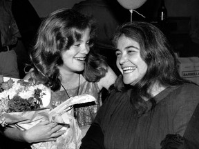 FILE  - In this May 21, 1979 file photo, feminist activist Kate Millett, right, laughs, during a surprise birthday party for her niece, Kristan Vigard, in New York. Millett, the activist, artist and educator whose best-selling "Sexual Politics" was a landmark of cultural criticism and a manifesto for the modern feminist movement, has died at 82, it was reported on Thursday, Sept. 7, 2017. (AP Photo/Ron Frehm, File)