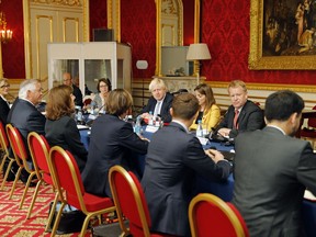 Britain's Foreign Secretary Boris Johnson, centre, sits opposite US Secretary of State Rex Tillerson, four left, ahead of their meeting, in London, Thursday, Sept. 14, 2017. Secretary of State Rex Tillerson is in London for talks Thursday on international efforts to pressure North Korea over its nuclear and missile programs, and on the chaos in Libya.(Tolga Akmen/Pool Photo via AP)