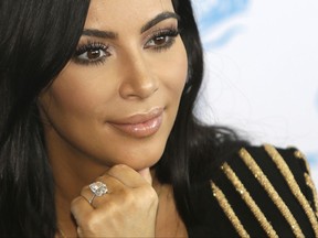 FILE - In this June 24, 2015 file photo, American TV personality Kim Kardashian attends the Cannes Lions 2015, International Advertising Festival in Cannes, southern France.  Kardashian West was held at gunpoint during a 2016 jewelry heist, and it is revealed Thursday Sept. 28, 2017, that Aomar Ait Khedache the alleged mastermind behind the Paris robbery of Kim Kardashian West has written a letter of apology to the reality TV star, from his prison cell. (AP Photo/Lionel Cironneau, FILE)