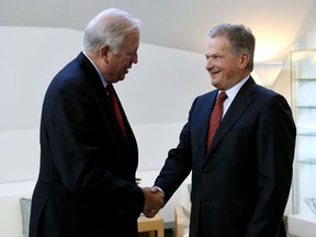 Finland's President Sauli Niinist, right, shakes hands with U.S. Under Secretary of State Tom Shannon at the President's Official Residence M'ntyniemi, Monday, Sept. 11, 2017, in Helsinki, Finland. Shannon is in Finland for negotiations with Russian Deputy Foreign Minister Sergei Ryabkov.  (Antti Aimo-Koivisto/Lehtikuva via AP)