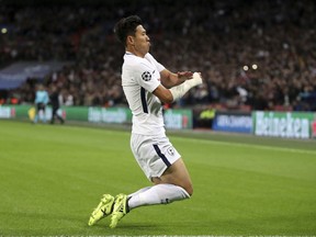 Tottenham Hotspur's Son Heung-Min celebrates after scoring the opening goal during the Champions League group H soccer match between Tottenham and Borussia Dortmund, at the Wembley stadium in London, Wednesday, Sept. 13, 2017. (Nick Potts/PA via AP)
