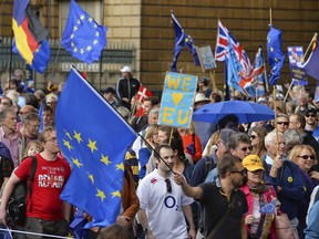 Demonstrators set off from at Hyde Park Corner in London, Saturday Sept. 9, 2017, protesting Britain's plans to withdraw from the European Union. The marchers plan to converge on Parliament Square to challenge the government's plan to implement Brexit by 2019. (John Stillwell/PA via AP)