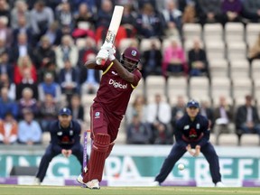 West Indies' Chris Gayle hits out during the fifth  One Day International cricket match against England  at the Ageas Bowl, Southampton England  Friday Sept.29, 2017. (Simon Cooper/PA via AP)
