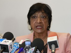 FILE- In this Thursday, May 29, 2014 file photo, the then U.N. Human Rights Commissioner Navi Pillay speaks during a press conference in Rabat, Morocco. Former top United Nations official has cited FIFA leaders who "violate ... standards of good conduct" when she resigned from a role monitoring integrity at soccer's world body. (AP Photo/Paul Schemm, File)