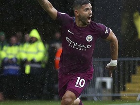 Manchester City's Sergio Aguero celebrates scoring his side's first goal of the game against Watford during their English Premier League soccer match at Vicarage Road in Watford, England, Saturday Sept. 16, 2017. (Nigel French/PA via AP)