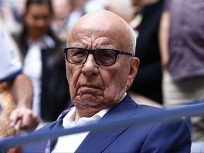 FILE- In this Sunday, Sept. 10, 2017 file photo, Rupert Murdoch waits for the start of the men's singles final of the U.S. Open tennis tournament between Rafael Nadal, of Spain, and Kevin Anderson, of South Africa, in New York. The British government said, Tuesday, Sept. 17, 2017, it is referring Twenty-First Century Fox Inc.'s bid for satellite broadcaster Sky to the country's competition regulator, in a blow to Rupert Murdoch's takeover plans. (AP Photo/Julio Cortez, File)