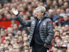 Crystal Palace manager Roy Hodgson gestures during the English Premier League soccer match between Manchester United and Crystal Palace at Old Trafford, Manchester, England. Saturday, Sept. 30, 2017.(Martin Rickett/PA via AP)