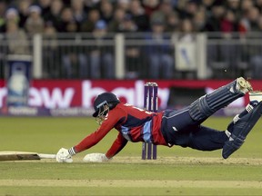 England's Jonny Bairstow dives in to survive a run out, during their T20 match at the Emirates Riverside stadium in Durham, England, Saturday Sept. 16, 2017.  (Richard Sellers/PA via AP)