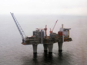 FILE - In this photo dated June 8 2006, The Troll, a gas platform run by the Norwegian oil giant Statoil company, standing above the North Sea, about 70 kilometers off the coast of Norway. Norway's sovereign wealth fund, the world's largest of its kind, has hit "a milestone" $1 trillion in value for the first time, beating all expectations since its creation over 20 years ago, on Tuesday, Sept. 19, 2017. (Marit Hommedal / Scanpix via AP, File)