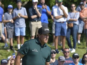Phil Mickelson makes an assessment of his putt on the 8th hole during final round of the Dell Technologies Championship at TPC Boston in Norton, Mass., Monday, Sept. 4, 2017. (Martin Gavin/The Sun Chronicle via AP)