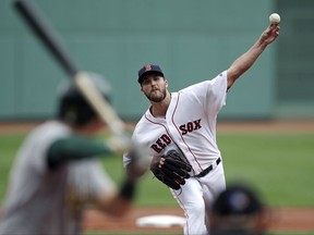 Boston Red Sox starting pitcher Drew Pomeranz delivers during the first inning of a baseball game against the Oakland Athletics at Fenway Park in Boston, Thursday, Sept. 14, 2017. (AP Photo/Charles Krupa)