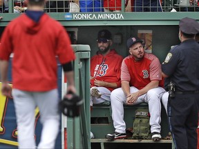 Boston Red Sox pitcher David Price, left, sits with relief pitcher Austin Maddox in the bullpen during the sixth inning of a baseball game against the Oakland Athletics at Fenway Park in Boston, Thursday, Sept. 14, 2017. Price was activated from the disabled list prior to the game and expected to work as a relief pitcher. (AP Photo/Charles Krupa)