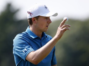 Jordan Spieth acknowledges the crowd after putting on the second hole during the final round of the Dell Technologies Championship golf tournament at TPC Boston in Norton, Mass., Monday, Sept. 4, 2017. (AP Photo/Michael Dwyer)