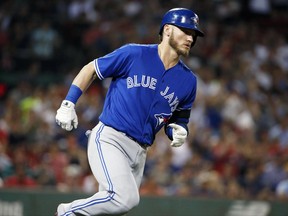 Toronto Blue Jays' Josh Donaldson rounds first base on his solo home run during the third inning of a baseball game against the Boston Red Sox in Boston, Tuesday, Sept. 26, 2017. (AP Photo/Michael Dwyer)