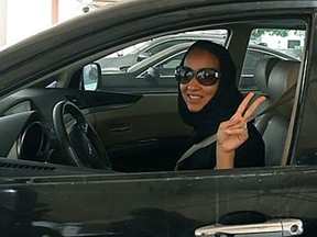 Saudi activist Manal Al Sharif drives in the UAE state of Dubai in an act of solidarity with protests against the ban in Saudi Arabia.