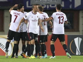 Milan's players celebrate after scoring during the Europa League group D first leg soccer match between Austria Vienna and AC Milan at the Ernst Happel Stadium in Vienna, Austria, Thursday, Sept. 14, 2017. (AP Photo/Ronald Zak)