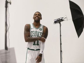 Boston Celtics' Kyrie Irving smiles during a photo shoot at NBA basketball media day, Monday, Sept. 25, 2017, in Canton, Mass. (AP Photo/Steven Senne)