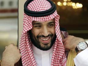 FILE - In this May 14, 2012 file photo, Prince Mohammed bin Salman waits for Gulf Arab leaders ahead of the opening of Gulf Cooperation Council summit, in Riyadh, Saudi Arabia. Known simply as MBS, the crown prince, oversees nearly every major aspect of the country's defense, economy, internal security, social reforms and foreign policy. He's also widely believed to be the force behind the kingdom's decision late on Tuesday, Sept. 26, 2017, to grant women the right to drive. (AP Photo/Hassan Ammar, File)