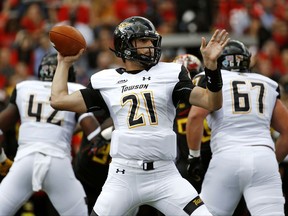 Towson quarterback Ryan Stover throws to a receiver in the first half of an NCAA college football game against Maryland in College Park, Md., Saturday, Sept. 9, 2017. (AP Photo/Patrick Semansky)