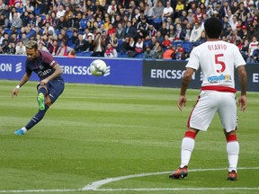 PSG's Neymar scores a free kick during a French League One soccer match Paris-Saint-Germain against Bordeaux at Parc des Princes stadium in Paris, France, Saturday, Sept. 30, 2017. (AP Photo/Michel Euler)