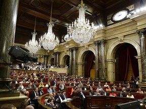 A general view during a plenary session at the Parliament of Catalonia in Barcelona, Spain, Wednesday, Sept. 6, 2017. Catalan lawmakers are voting on a bill that will allow regional authorities to officially call an Oct. 1 referendum on a split from Spain, making concrete a years-long defiance of central authorities, who see the vote as illegal. (AP Photo/Manu Fernandez)