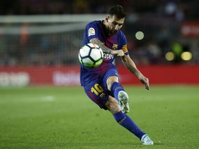 FC Barcelona's Lionel Messi kicks the ball during the Spanish La Liga soccer match between FC Barcelona and Eibar at the Camp Nou stadium in Barcelona, Spain, Tuesday, Sept. 19, 2017. (AP Photo/Manu Fernandez)