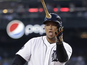 Detroit Tigers' Miguel Cabrera tosses his bat after receiving a base on balls during the first inning of a baseball game against the Minnesota Twins, Thursday, Sept. 21, 2017, in Detroit. (AP Photo/Carlos Osorio)