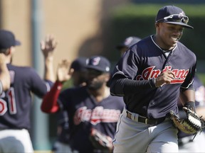 Cleveland Indians' Greg Allen runs to the dugout after the ninth inning of a baseball game against the Detroit Tigers, Sunday, Sept. 3, 2017, in Detroit. The Indians won 11-1 and swept the four-game series. (AP Photo/Carlos Osorio)
