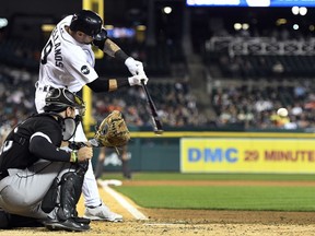 Detroit Tigers' Nicholas Castellanos singles against the Chicago White Sox during the fourth inning of a baseball game, Friday, Sept. 15, 2017, in Detroit. (AP Photo/Jose Juarez)