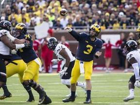 Michigan quarterback Wilton Speight (3) throws a pass in the first quarter of an NCAA college football game against Cincinnati in Ann Arbor, Mich., Saturday, Sept. 9, 2017. (AP Photo/Tony Ding)