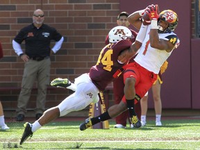 Maryland wide receiver D.J. Moore (1) makes a touchdown catch in front of Minnesota cornerback Antonio Shenault (34) in the second quarter of an NCAA college football game on Saturday, Sept. 30, 2017, in Minneapolis.(AP Photo/Andy Clayton-King)