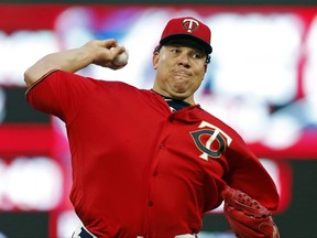 Minnesota Twins pitcher Bartolo Colon throws to a Toronto Blue Jays batter during the first inning of a baseball game Friday, Sept. 15, 2017, in Minneapolis. (AP Photo/Jim Mone)